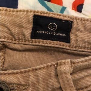 AG tan skinny leg zipper bottom jeans